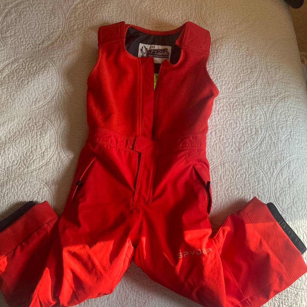Red Spyder snow suit with adjustable shoulder straps.  Size 5 Ski.